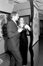 Beth Haynes and Brian Butler (left) help decorate the interactive graffiti installation.