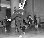 Olufemi Omojola, a graduate student in computer science, holds Nia Jetter, a senior in mathematics, as they complete a dance in Lobby 7 with their troupe Movements in Time during Campus Preview Weekend.