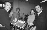 Gathered around the table they developed to test and predict the stability of concrete over long periods of time are (left to right) postdoc Marc Mainguy; graduate student Franz Heukamp; Jennifer Butz, a junior in civil engineering; and Professor Franz Ulm. Concrete samples are treated on this seesawing table, immersed in the container at right. To the left are examples of concrete before immersio...