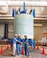 The inner module of a superconducting magnet built by the US team (left picture), with magnet team members including Rui Vieira of MIT (far left); and the outer module built by the Japanese team (center picture). At right is a cutaway drawing of the full assembly of both modules combined with the structure provided by the US.
