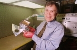 George Ricker holds part of a device built at MIT to detect gamma-ray bursts. The satellite, the High-Energy Transient Explorer (HETE-2), is the first dedicated to the study of gamma-ray bursts.