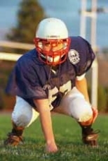Officer Theresa Gomes in uniform for her off-duty role -- as a linebacker.