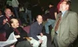 Nobelist David Baltimore (standing) a former MIT faculty member who is now president of Caltech, shares a laugh with biology faculty members (left to right) Richard O. Hynes, director of the Center for Cancer Research; Alexander Rich; and H. Robert Horvitz. Dr. Baltimore was on campus to give the Howard Hughes Lecture in biology.