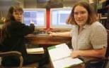 Graduate student Susan Kern (left) and Erica McEvoy, a sophomore in physics, discuss data obtained from the Magellan telescope.