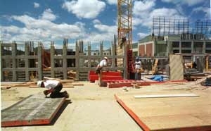 Looking through the evolving concrete-grid exterior of Simmons Hall, the undergraduate residence being built on Vassar Street.