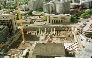 A bird's-eye view from atop Building 54 of the Stata Center site, flanked by Building 26 (left), East Garage (right) and the Alumni Pool (center foreground).