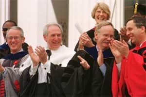 Applauding a gift presentation are (left to right) Associate Provost Phillip Clay, President Charles M. Vest, Commencement speaker Daniel Goldin, Provost Robert A. Brown, the Rev. Constance Parvey (behind Brown), and Chancellor Larry Bacow.