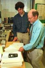 Graduate student Peter Reddien (left) and Professor Bob Horvitz of biology made a discovery about programmed cell death in C. elegans roundworms.