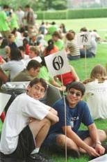 LEFT: Freshmen load up on food as they get acquainted with MIT.
ABOVE: Dean for Student Life Larry Benedict is a "victim" of the "survivor" spoof duringopening ceremonies for freshmen.
RIGHT: Freshmen orientation groups meet ouside Kresge after the opening ceremonies.
