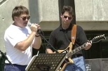 Robert Cunkelman (left) and David Silverman of Facilities performed with the rock band O-Zone on the Stratton Student Center steps.