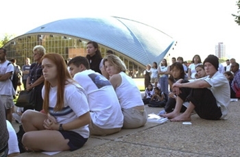 Students listen and reflect at the vigil on the steps of the Stratton Student Center Tuesday evening
