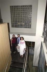 Christina Silcox (left) stands with housemasters Steven and Lori Lerman in the new 224 Albany St. residence, which Silcox says already has a sense of community.