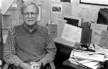 Kenneth Hale posed in 1995 with some of the dictionaries and grammar books he compiled of near-extinct languages in Nicaragua, Australia and other locations.