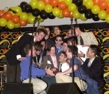 Mrs. Rebecca Vest is serenaded by the MIT Logarhythms singing "Baby Face" during the Infinite Buffet.