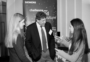 Winning team members Dora Sosnowik (left) and Shira Billet, both seniors at Stella K. Abraham High School for Girls in Hewlett Bay Park, N.Y., chat with keynote speaker Eric Lander, director of the Whitehead Institute's Center for Genome Research and professor of biology, at the New England regional Siemens Westinghouse Science & Technology Competition. Sosnowik and Billet developed a precise ...