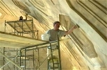 In a scene reminiscent of the Sistine Chapel, two craftsmen from the John Canning Co. do conservation painting on the plaster on the Lobby 7 dome interior.