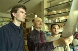 Research scientist Stefan W. Maas (left), Professor Alexander Rich and junior Jay Shrestha, another
member of Rich's research team, examine data from their study on the link between RNA editing and brain tumors.