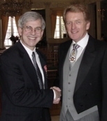 Professor Linn W. Hobbs (left) is congratulated on his honorary OBE by British Ambassador Sir Christopher Meyer.
