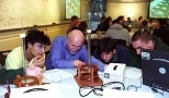 Professor of Physics John W. Belcher (second from left) surveys an experiment in the new interactive TEAL classroom being done by (left to right) freshman Bernardo Zacka, mechanical engineering sophomore Matthew Socks and mathematics sophomore John Gonzalez.