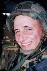 MIT Director of Safety Programs Jerry Diaz, a  registered nurse and a master sergeant in the Army, in a Black Hawk helicopter  in Kosovo.