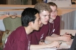 The MIT programming team works on a problem at the world finals of the ACM computer programming contest in Honolulu last month. Left to right: Sophomore Percy Liang, freshman Reid Barton and sophomore John Danaher came in second place, the best MIT finish in more than two decades.