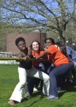 Saturday's "Class Wars" games pitted class against class. (Left to right) Chi Chi Obi, Megan Brett and Adrienne Manns of the Class of 2004 team led the winning effort against the Class of 2002 in Tug of War.