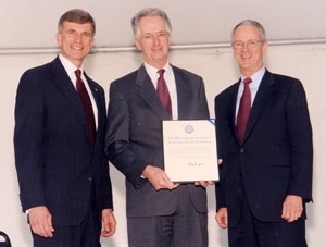 After presenting Lincoln Laboratory with the Secretary of Defense Medal for Outstanding Public Service, Ron Sega (left), director of defense research and engineering in the Department of Defense, posed with Lincoln Lab's director, David Briggs (center), and President Charles Vest.