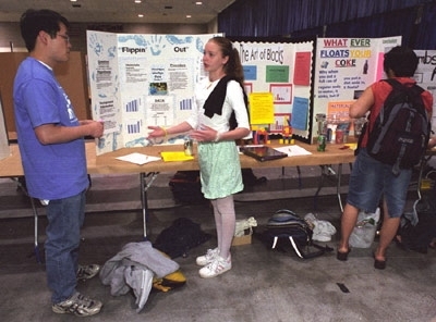 Yee Su, a graduate student in chemical engineering, and Monique Pare of the Peabody School discuss Monique's work.