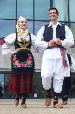 Tania Nouchev and Djordje (George) Koldzic display their Serbian finery during the fashion show at last month's International Fair. Similar costumes will be seen at Saturday's performance of Serbian and Balkan music and dance in Kresge.