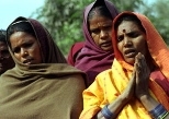 Women in Mahilwari sing to show their gratitude for efforts to clean the water.