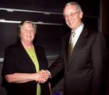 Teresa O'Connor, house manager of Eastgate, is congratulated by President Vest  for winning the James N. Murphy Award.