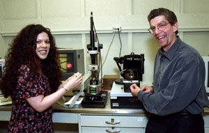 Professors Christine Ortiz and Alan Grodzinsky stand by a new nanomechanical instrument called the molecular force probe that will aid nanoscale studies of cartilage.