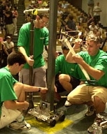 The Green Team -- from left, Christophe Matricon-Grangier, Bruno  Tebaldi Barbosa, Jung Ho Lee and Arron Parness -- puts the finishing touches on  their machine before the final IDC competition.