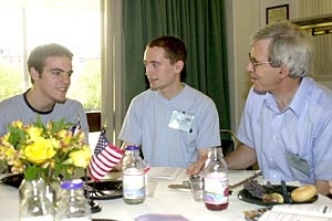 MIT materials science professor        Linn Hobbs, right, chats with Cambridge University students Nicholas Mott,        left, and Edmund Ward at a welcome brunch for Cambridge/MIT Institute students        held at the MIT student center.