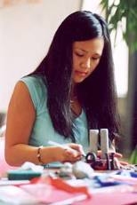 Freshman Christina Huang crafts clay sculpture of the Twin Towers.