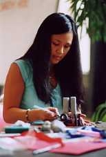 Christina Huang, a freshman from Queens, crafts a clay sculpture of the World Trade Center at the open art studio on Sept. 11. Huang was in math class at the Bronx High School of Science when the terrorist attacks occurred.