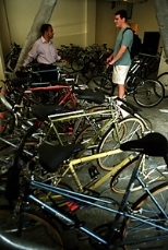 Graduate students Sham Sokka (left) and Chris Cassa chat in the bike room at the new graduate dorm at 70 Pacific St. Students can rent bikes for $1 a day or store their own bikes there.