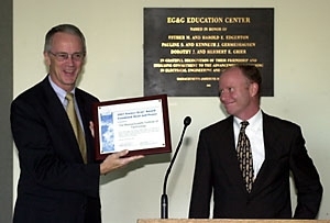President Charles M. Vest (left) receives an award from Mike Kenyon of the U.S. Environmental Protection Agency and Department of Energy for increasing energy efficiency and reducing pollution at the William R. Dickson Cogeneration Facility.