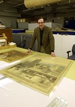 Gary Van Zante looks at part of the MIT Museum's        architecture and design collection.