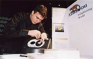 Josh Ornstein makes a final adjustment to Kinkajou, a battery-operated microfilm projector that uses modified VHS cassettes to store up to 10,000 pages of material. The system was designed for use in        classrooms in developing countries.