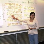 Electrical engineering and computer science sophomore Sumudu Watugala points to her notes during her UPOP presentation about optimizing the registration process for HASS-D courses.