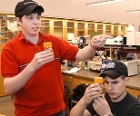 Billie Bonner and John Dulong of Hudson High School examine lab materials