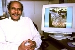 Professor Elfatih Eltahir of civil and environmental engineering sits by a monitor showing rock art of a giraffe carved thousands of years ago when portions of the Sahara were still green.
������