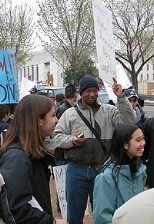Graduate student Anthony Bankhead and junior Michelle Nyein (right) and their MIT colleagues queue up at the U.S. Supreme Court building.
