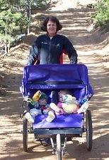 MIT administrator Andrea Hatch pushes her grandchildren, 14-month-old twins Wesley and Adabelle Wright, during a marathon training session in Colorado Springs.