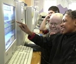 David Foxe, an MIT senior in architecture and UROP assisting in the Toy Symphony project, admires the Hyperscore composition of Chaniece Newberry at an after-school program for Cambridge's Margaret Fuller Neighborhood House.