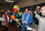 Professor Ronald L. Rivest enjoys the revelry at a surprise party in his 6.045 class to celebrate his selection for the Turing Award. Among the celebrants were Be Blackburn (left), Rivest's administrative assistant for 17 years, and his colleague, Professor Silvio Micali (far right).