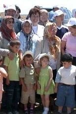 MIT Professor Jan Wampler (back left), who initiated the project, is surrounded by the families who will own homes in Berikoy.