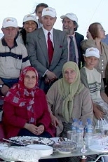 Halim Neyzi (standing center), a member of Berikoy steering committee, poses with architect Jan Wampler (on his left), Betil Sozen (looking away), also on the steering committee, and members of the families who will live in the houses.