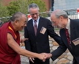 The Dalai Lama was greeted by Charles M. Vest and Director of the McGovern Institute for Brain Research Phillip A. Sharp (right).